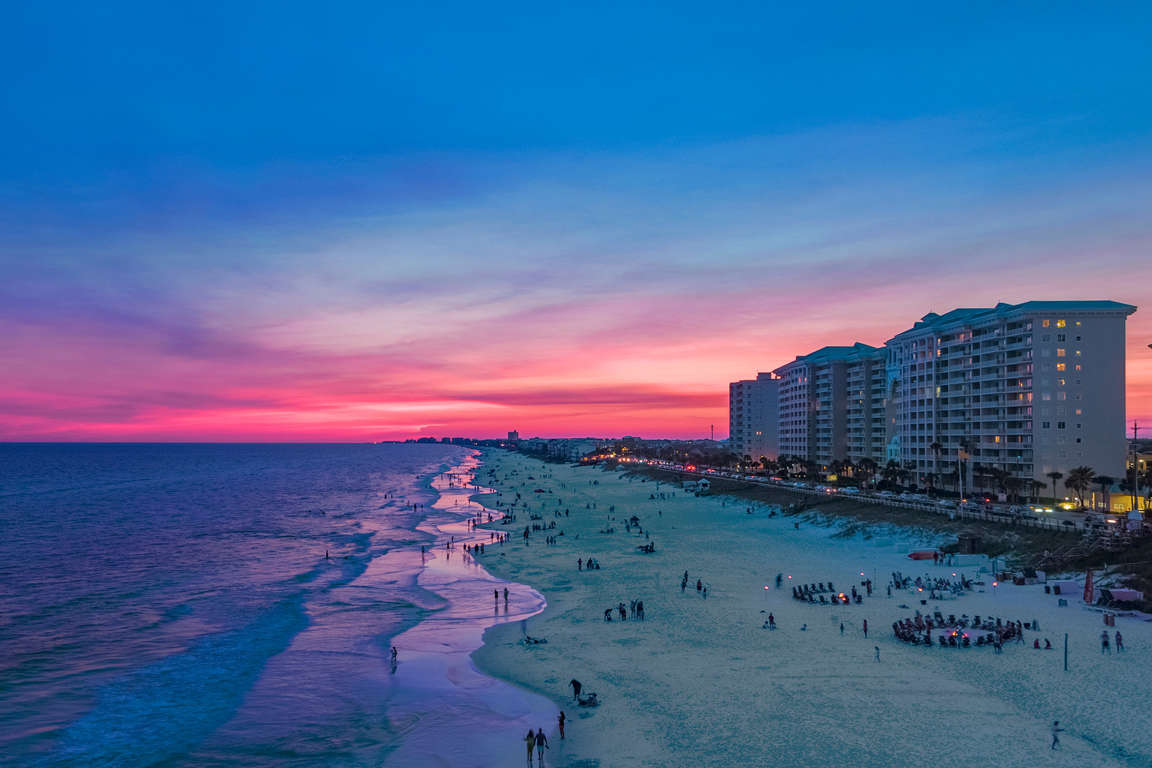 Majestic Sun resort at sunset in Miramar Beach, Florida
